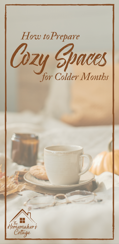 A cup and saucer, sitting on a cozy bed, with fall leaves, a candle and pumpkin with the text "How to prepare cozy spaces for colder months".